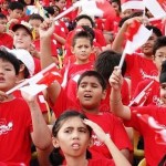 Singapore children waving flags