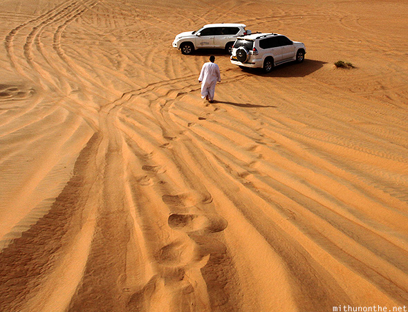 Oman desert footsteps SUVs