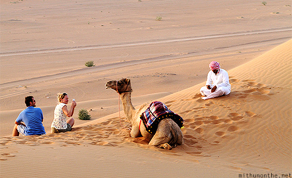 Tourists camel Oman desert