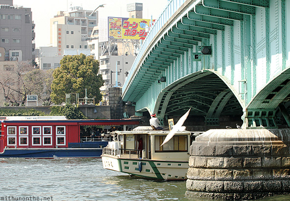 Boats going under bridge Sumida river-tokyo
