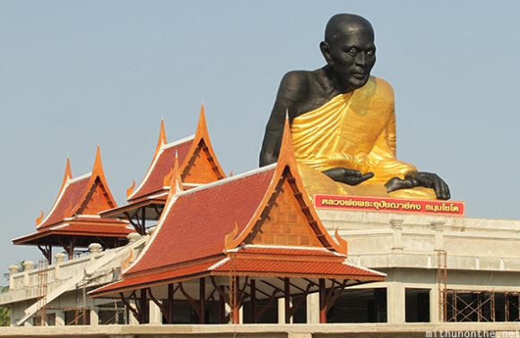 Black Buddha statue Amphawa Thailand