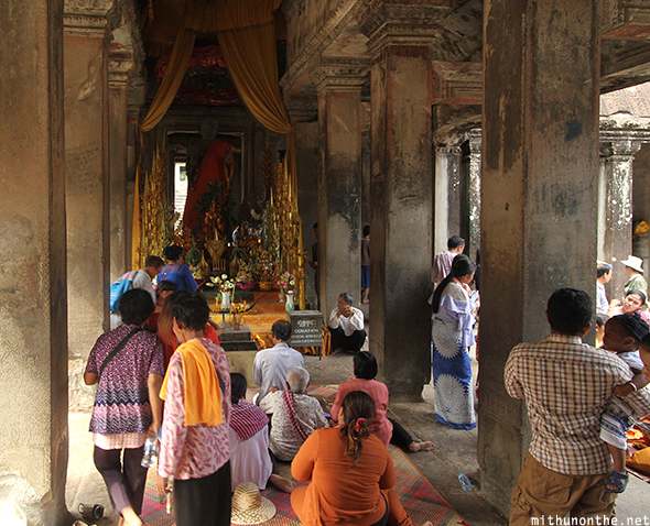 Buddhist prayer inside Angkor Wat