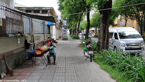 Streetside barber Ho Chi Minh city