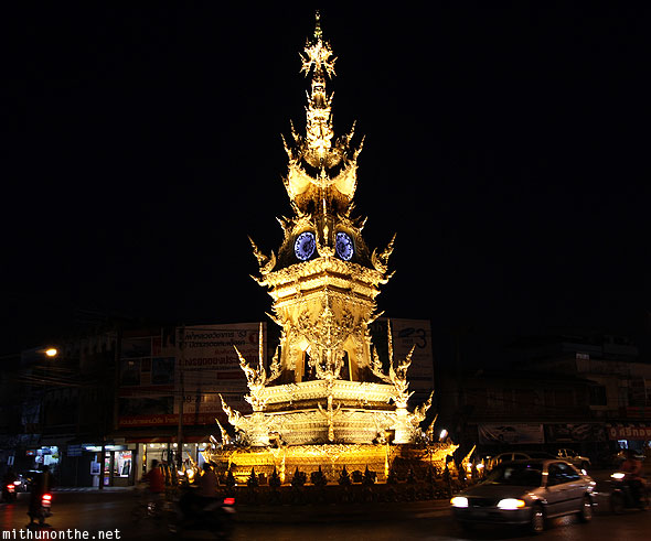 Golden clock tower at night Chiang Rai Thailand