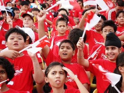 Singapore children waving flags